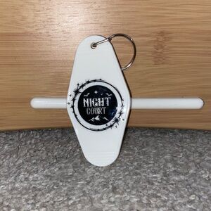 NWOT White Night Court Hotel Keychain